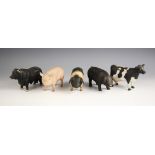 Five porcelain farmyard animals, each naturalistically modelled, comprising: three pigs, 9cm high,