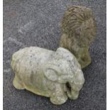 Two reconstituted stone garden ornaments, one modelled as a seated lion, the other as an elephant,