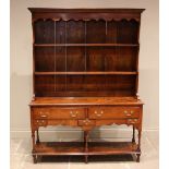 A George III style figured elm pot board dresser, 20th century, the high back with a moulded cornice