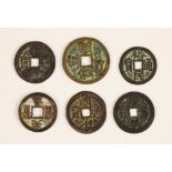 A collection of six Chinese Ming dynasty and later cash coins (Qian), to include Han and Tang