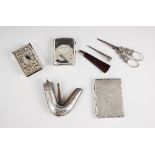 A selection of silver and silver coloured items, comprising a Victorian silver card case, Deakin &