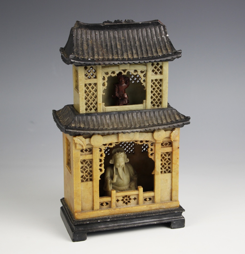 A Chinese carved soapstone pagoda, late 19th century, the sectional shrine carved with internal