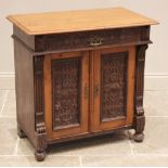 A Victorian pitch pine ecclesiastical side cabinet, late 19th century, the rectangular moulded top