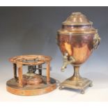 A Regency copper samovar of urn form, applied with side ring handles upon a integral plinth base (at