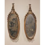 A pair of French giltwood and gesso wall mirrors, late 19th/early 20th century, each with a ribbon