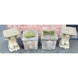 A pair of reconstituted stone garden plinths, each designed as a kneeling fawn supporting a cushion,