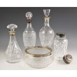 A selection of silver collared glass decanters, to include a tapered glass decanter, B P Co,