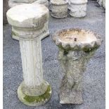 A reconstituted stone figural bird bath / water feature, the shallow well modelled as a clam shell