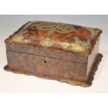 A 19th century faux tortoishell work box, the cushion top cover with shaped rim and brass pique,