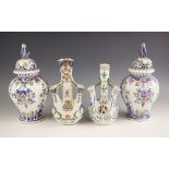 A near pair of French faience jars and covers, 20th century, of lobed inverted baluster form, the