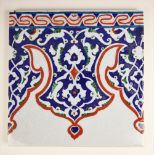 A Persian Iznik glazed tile, 20th century, the tile of square section decorated in blue, red and