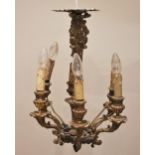 A French gilt metal six branch chandelier, early 20th century, the central upright cast with fruit