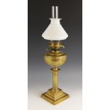 A Victorian Duplex oil lamp, late 19th century, the reeded Doric column on stepped square base, with