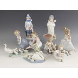 Eight Lladro figures, late 20th century, comprising: a boxed "My Debut", 12cm high, a seated girl on