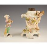 A Meissen porcelain figure of a boy in bicorn hat holding a chicken, set to a scrolled gilt