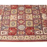 A 'Heavy Domestic Wilton' carpet by Carmel Carpets, Israel, in red, blue, ivory and yellow