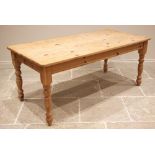 A Victorian style pine kitchen table, late 20th century, the rectangular top with rounded corners,