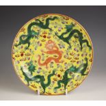 A Chinese porcelain yellow ground dragon dish, Qianlong seal mark, the shallow circular dish