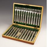 An Edwardian silver cased fish service, Martin Hall and Co, Sheffield 1908, the twenty-four piece