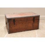 A metal bound pine storage/travel trunk, early 20th century, applied with iron side swing handles