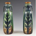 A pair of studio pottery Art Nouveau style vases, 20th century, each with garlic bulb neck and