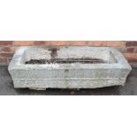 An 18th/19th century granite trough, of rectangular form, with drain hole to the interior, scored