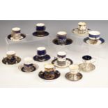A selection of silver mounted coffee cans and saucers, to include a Coalport coffee can and