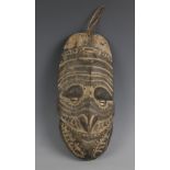A Papua New Guinea tribal mask, 20th century, the oval long oval shaped face with painted decoration