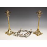A pair of silver plated brass Art Nouveau candlesticks, late 19th century/early 20th century, the