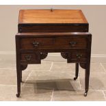 A late George III oak bureau on stand, the hinged fall front opening to an arrangement of small