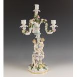 A German porcelain florally encrusted four branch candelabrum by Dornheim, Koch, & Fischer, late
