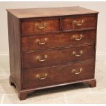 A George III oak chest of drawers, the rectangular moulded top over two short and three long
