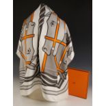 An Hermes silk scarf, in the Quadridge II pattern designed by Pierre Peron, in grey and orange, with