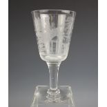 A glass chalice, early 20th century, the funnel bowl wheel cut with continuous hunting scene, on