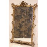 A French rococo gilt wood and gesso pier mirror, late 19th century, with a scrolled foliate and