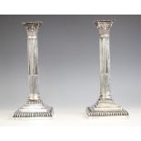 A pair of Victorian silver candlesticks, Goldsmiths & Silversmiths Co, London 1894, the weighted