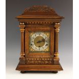 A German walnut cased bracket clock, early 20th century, the architectural case with fluted