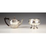 An Edwardian silver pedestal sugar bowl, Chester 1908, the flared rim above bulbous body upon