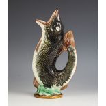 A Majolica gurgle or glug jug, mid 20th century, of typical fish form, with polychrome decoration,