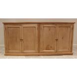 A Victorian and later stripped pine scullery/kitchen cupboard, the later plank top over two pairs of