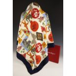 A Salvatore Ferragamo silk scarf, decorated in an abstract design depicting flora and fauna,