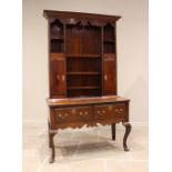 A George III style oak dresser, of cottage proportions, 20th century, the high back with a moulded