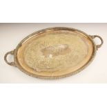 A large oval silver plated tray, the gadroon rim above a engraved acorn and foliate decoration