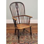 * A 19th century ash and alder wood hoop back Windsor farmhouse chair, the stick back centred with a