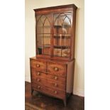* A late George III mahogany secretaire bookcase, the moulded cornice over a pair of arcaded