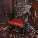 * A 17th century oak Wainscot chair, the gadrooned top rail flanked by acorn finials above the