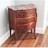 * A Louis XVI kingwood and marquetry petite commode chest, late 19th century, the shaped rouge