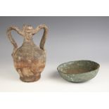 An Etruscan bronze bowl, possibly 2nd century B.C.–2nd century A.D., of simple design, with