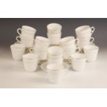 A collection of Salon China teacups and saucers, each white glazed with gilt floral detail