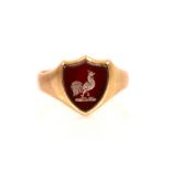 A 9ct rose gold signet ring, the carnelian shield shaped matrix with engraved cockerel seal, leading